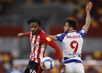 Soccer Football - Championship - Brentford v Reading - Brentford Community Stadium, London, Britain - December 19, 2020 Brentford's Tariqe Fosu in action with Reading’s Sam Baldock Action Images/John Sibley EDITORIAL USE ONLY. No use with unauthorized audio, video, data, fixture lists, club/league logos or 'live' services. Online in-match use limited to 75 images, no video emulation. No use in betting, games or single club /league/player publications.  Please contact your account representative for further details.