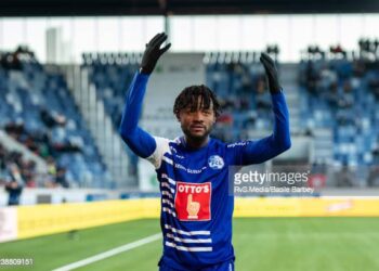 LAUSANNE, SWITZERLAND - FEBRUARY 27: Asumah Abubakar #21 of FC Luzern celebrates his goal with fans during the Swiss Super League match between FC Lausanne-Sport and FC Luzern at Stade de la Tuiliere on February 27, 2022 in Lausanne, Switzerland. (Photo by RvS.Media/Basile Barbey/Getty Images)