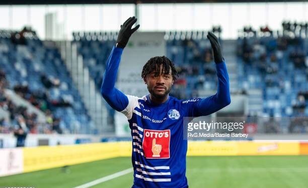 LAUSANNE, SWITZERLAND - FEBRUARY 27: Asumah Abubakar #21 of FC Luzern celebrates his goal with fans during the Swiss Super League match between FC Lausanne-Sport and FC Luzern at Stade de la Tuiliere on February 27, 2022 in Lausanne, Switzerland. (Photo by RvS.Media/Basile Barbey/Getty Images)