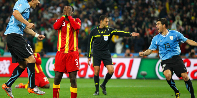 JOHANNESBURG, SOUTH AFRICA - JULY 02:  Asamoah Gyan of Ghana reacts as he misses a late penalty kick in extra time to win the match during the 2010 FIFA World Cup South Africa Quarter Final match between Uruguay and Ghana at the Soccer City stadium on July 2, 2010 in Johannesburg, South Africa.  (Photo by Cameron Spencer/Getty Images)