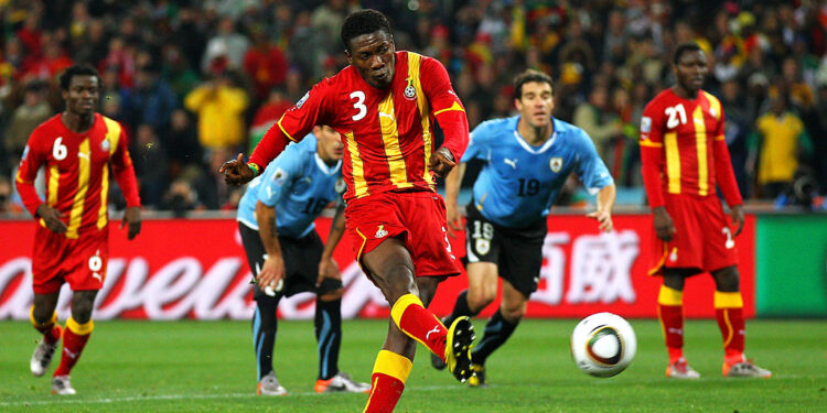 JOHANNESBURG, SOUTH AFRICA - JULY 02:  Asamoah Gyan of Ghana shoots a late penalty high during the 2010 FIFA World Cup South Africa Quarter Final match between Uruguay and Ghana at the Soccer City stadium on July 2, 2010 in Johannesburg, South Africa.  (Photo by Cameron Spencer/Getty Images)