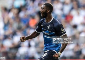 HAMBURG, GERMANY - AUGUST 19:  (EDITORS NOTE: Image has been digitally enhanced.) Patric Pfeiffer of SV Darmstadt 98 celebrates after scoring his team's first goal during the Second Bundesliga match between Hamburger SV and SV Darmstadt 98 at Volksparkstadion on August 19, 2022 in Hamburg, Germany. (Photo by Boris Streubel/Bundesliga/Bundesliga Collection via Getty Images)