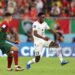 DOHA, QATAR - NOVEMBER 24: Baba Rahman of Ghana and Joao Cancelo of Portugal during the FIFA World Cup Qatar 2022 Group H match between Portugal and Ghana at Stadium 974 on November 24, 2022 in Doha, Qatar. (Photo by Youssef Loulidi/Fantasista/Getty Images)