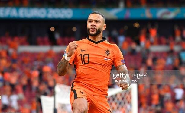 AMSTERDAM, NETHERLANDS - JUNE 17: Memphis Depay of Netherlands celebrates after scoring their side's first goal during the UEFA Euro 2020 Championship Group C match between the Netherlands and Austria at Johan Cruijff Arena on June 17, 2021 in Amsterdam, Netherlands. (Photo by Olaf Kraak - Pool/Getty Images)
