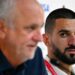 Australia's defender Aziz Behich (R) looks at coach Graham Arnold during a press conference. Photo: Chandan Khanna / AFP Source: AFP