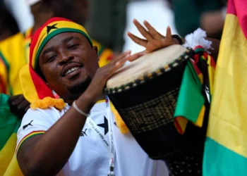 A Ghanaian fan plays a traditional drum prior to the World Cup group H football match between South Korea and Ghana, at the Education City Stadium in Qatar, Monday, November 28, 2022. [Julio Cortez/AP Photo]