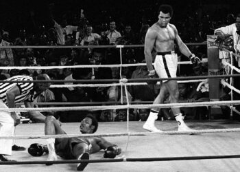 FILE -- Referee Zack Clayton counts out George Foreman as Muhammed Ali looks on in the 8th round of their title bout in Kinshasa, Zaire, in this Oct. 30, 1974 photo. (AP Photo/Jim Boudier, File)