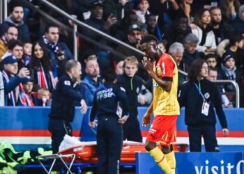 RC Lens midfielder Abdul Salis Samed leaves the pitch after being red carded following a harsh tackle on PSG star Achraf Hakimi
