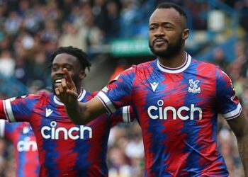 Jeffery Schlupp joins Jordan Ayew in celebrating his second goal against Leeds United