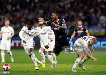 PERTH, AUSTRALIA - JULY 22: Jordan Ayew of Crystal Palace is fouled by Rasmus Kristensen of Leeds United during the pre-season friendly match between Leeds United and Crystal Palace at Optus Stadium on July 22, 2022 in Perth, Australia. (Photo by Paul Kane/Getty Images)