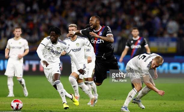 PERTH, AUSTRALIA - JULY 22: Jordan Ayew of Crystal Palace is fouled by Rasmus Kristensen of Leeds United during the pre-season friendly match between Leeds United and Crystal Palace at Optus Stadium on July 22, 2022 in Perth, Australia. (Photo by Paul Kane/Getty Images)