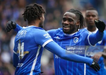 Genk's Ghanaian midfielder Joseph Paintsil (C) celebrates with Genk's Belgian midfielder Mike Tresor Ndayishimiye (L) after scoring his teams fifth goal during the Belgian Pro League football match between KRC Genk and RSC Anderlecht in Genk on April 16, 2023. (Photo by VIRGINIE LEFOUR / Belga / AFP) / Belgium OUT (Photo by VIRGINIE LEFOUR/Belga/AFP via Getty Images)