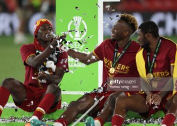TIRANA, ALBANIA - MAY 25: Felix Afena-Gyan, Tammy Abraham and Ainsley Maitland-Niles of AS Roma sit on the winners podium after winning the UEFA Conference League final match between AS Roma and Feyenoord at Arena Kombetare on May 25, 2022 in Tirana, Albania. (Photo by Matthew Ashton - AMA/Getty Images)