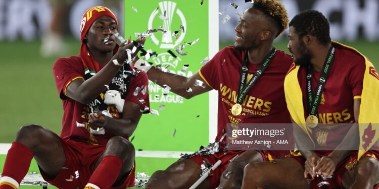 TIRANA, ALBANIA - MAY 25: Felix Afena-Gyan, Tammy Abraham and Ainsley Maitland-Niles of AS Roma sit on the winners podium after winning the UEFA Conference League final match between AS Roma and Feyenoord at Arena Kombetare on May 25, 2022 in Tirana, Albania. (Photo by Matthew Ashton - AMA/Getty Images)