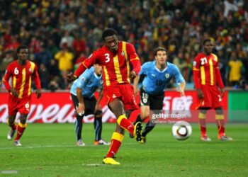 JOHANNESBURG, SOUTH AFRICA - JULY 02:  Asamoah Gyan of Ghana shoots a late penalty high during the 2010 FIFA World Cup South Africa Quarter Final match between Uruguay and Ghana at the Soccer City stadium on July 2, 2010 in Johannesburg, South Africa.  (Photo by Cameron Spencer/Getty Images)