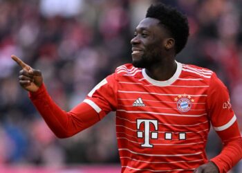 Bayern Munich's Canadian midfielder Alphonso Davies reacts after scoring during the German first division Bundesliga football match between Bayern Munich and Augsburg in Munich on March 11, 2023. (Photo by Christof STACHE / AFP) / DFL REGULATIONS PROHIBIT ANY USE OF PHOTOGRAPHS AS IMAGE SEQUENCES AND/OR QUASI-VIDEO (Photo by CHRISTOF STACHE/AFP via Getty Images)