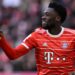 Bayern Munich's Canadian midfielder Alphonso Davies reacts after scoring during the German first division Bundesliga football match between Bayern Munich and Augsburg in Munich on March 11, 2023. (Photo by Christof STACHE / AFP) / DFL REGULATIONS PROHIBIT ANY USE OF PHOTOGRAPHS AS IMAGE SEQUENCES AND/OR QUASI-VIDEO (Photo by CHRISTOF STACHE/AFP via Getty Images)
