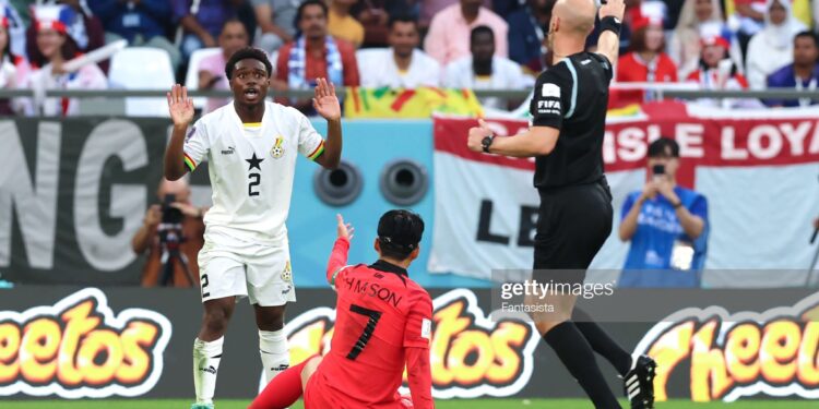 AL RAYYAN, QATAR - NOVEMBER 28: Tariq Lamptey of Ghana reacts as the Referee Anthony Taylor of England awards a free kick against him for a foul on Son Heung-min of South Korea during the FIFA World Cup Qatar 2022 Group H match between Korea Republic and Ghana at Education City Stadium on November 28, 2022 in Al Rayyan, Qatar. (Photo by Youssef Loulidi/Fantasista/Getty Images)