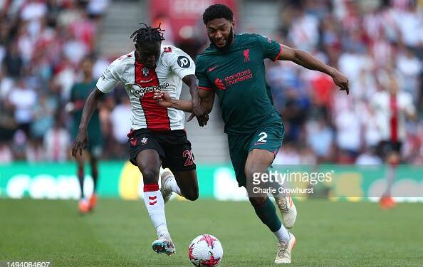SOUTHAMPTON, ENGLAND - MAY 28: Kamaldeen Sulemana of Southampton battles for the ball with Liverpool's Joe Gomez during the Premier League match between Southampton FC and Liverpool FC at Friends Provident St. Mary's Stadium on May 28, 2023 in Southampton, England. (Photo by Charlie Crowhurst/Getty Images)