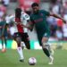 SOUTHAMPTON, ENGLAND - MAY 28: Kamaldeen Sulemana of Southampton battles for the ball with Liverpool's Joe Gomez during the Premier League match between Southampton FC and Liverpool FC at Friends Provident St. Mary's Stadium on May 28, 2023 in Southampton, England. (Photo by Charlie Crowhurst/Getty Images)