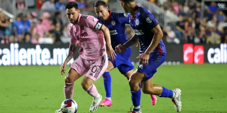 Inter Miami’s Argentine forward Lionel Messi tries to dribble past Cruz Azul’s players during the Leagues Cup Group J football match between Inter Miami CF and Cruz Azul at DRV PNK Stadium in Fort Lauderdale, Florida, on July 21, 2023. (Photo by Chris Arjoon / AFP)