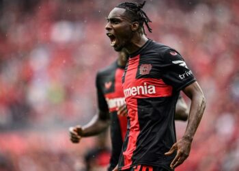 LEVERKUSEN, GERMANY - AUGUST 19: Scorer Jeremie Frimpong (L) of Leverkusen celebrates his teamÕs first goal during the Bundesliga match between Bayer 04 Leverkusen and RB Leipzig at BayArena on August 19, 2023 in Leverkusen, Germany. (Photo by Lukas Schulze/Bundesliga/Bundesliga Collection via Getty Images)