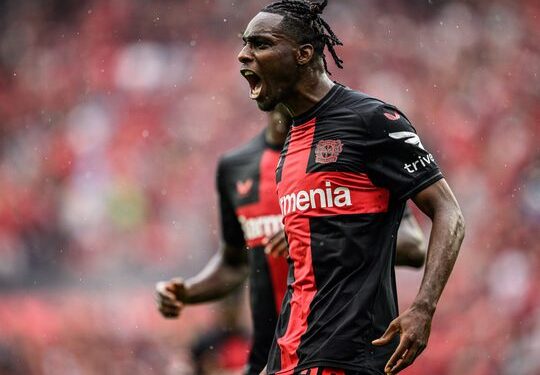 LEVERKUSEN, GERMANY - AUGUST 19: Scorer Jeremie Frimpong (L) of Leverkusen celebrates his teamÕs first goal during the Bundesliga match between Bayer 04 Leverkusen and RB Leipzig at BayArena on August 19, 2023 in Leverkusen, Germany. (Photo by Lukas Schulze/Bundesliga/Bundesliga Collection via Getty Images)