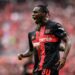 LEVERKUSEN, GERMANY - AUGUST 19: Scorer Jeremie Frimpong (L) of Leverkusen celebrates his teamÕs first goal during the Bundesliga match between Bayer 04 Leverkusen and RB Leipzig at BayArena on August 19, 2023 in Leverkusen, Germany. (Photo by Lukas Schulze/Bundesliga/Bundesliga Collection via Getty Images)