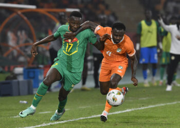 Jean Michael Seri of Cote dIvoire  challenges Pape Matar Sarr of Senegal during the 2023 Africa Cup of Nations  Last 16 match between Senegal and Ivory Coast at  Charles Konan Stadium in Yamoussoukro on the 29 January 2024 © Sydney Mahlangu/BackpagePix