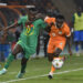 Jean Michael Seri of Cote dIvoire  challenges Pape Matar Sarr of Senegal during the 2023 Africa Cup of Nations  Last 16 match between Senegal and Ivory Coast at  Charles Konan Stadium in Yamoussoukro on the 29 January 2024 © Sydney Mahlangu/BackpagePix