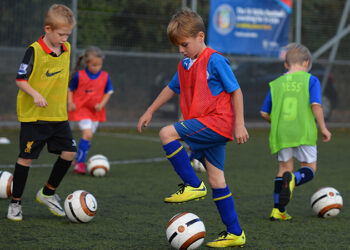 WHETSTONE, ENGLAND - OCTOBER 03:  Boys and girls taking part in the FA Skills training session at Holmes Park on October 3, 2014 in Whetstone, England.  (Photo by Tony Marshall - The FA/The FA via Getty Images)