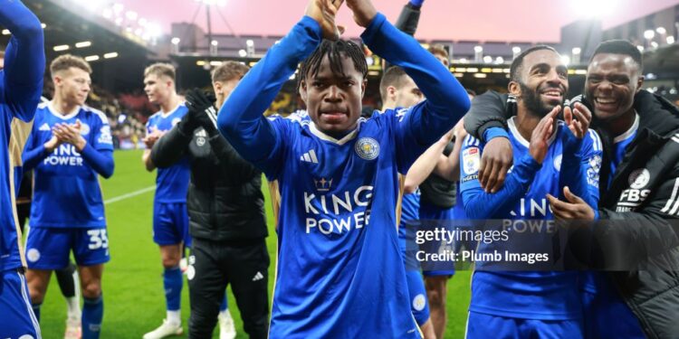 WATFORD, ENGLAND - FEBRUARY 10: Abdul Fatawu of Leicester City applauds the travelling Leicester City fans after the Sky Bet Championship match between Watford and Leicester City at Vicarage Road on February 10, 2024 in Watford, United Kingdom. (Photo by Plumb Images/Leicester City FC via Getty Images)