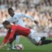 Manchester United's Cristiano Ronaldo (right) and Fulham's John Pantsil (left) battle for the ball.   (Photo by Anthony Devlin - PA Images/PA Images via Getty Images)