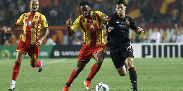 Emam Ashour of Al Ahly challenged by Roger Ben Boris Aholou of Esperance Tunis during the CAF Champions League 2023/24 1st leg final match between Esperance Tunis and Al Ahly at Hammadi Agrebi Stadium in Rades, Tunisia on the 18 May 2024 ©BackpagePix
