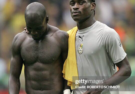 Dortmund, GERMANY:  Ghanaian midfielder Stephen Appiah (L) and Ghanaian midfielder Derek Boateng (R) leave the pitch after their defeat in the round of 16 World Cup football match between Brazil and Ghana at Dortmund's World Cup Stadium, 27 June 2006. Brazil won the match 3-0 and will play either France or Spain in the next round.     AFP PHOTO / ROBERTO SCHMIDT  (Photo credit should read ROBERTO SCHMIDT/AFP via Getty Images)