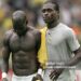 Dortmund, GERMANY:  Ghanaian midfielder Stephen Appiah (L) and Ghanaian midfielder Derek Boateng (R) leave the pitch after their defeat in the round of 16 World Cup football match between Brazil and Ghana at Dortmund's World Cup Stadium, 27 June 2006. Brazil won the match 3-0 and will play either France or Spain in the next round.     AFP PHOTO / ROBERTO SCHMIDT  (Photo credit should read ROBERTO SCHMIDT/AFP via Getty Images)