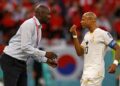 TOPSHOT - Ghana's coach Otto Addo (L) speaks with Ghana's midfielder #10 Andre Ayew during the Qatar 2022 World Cup Group H football match between South Korea and Ghana at the Education City Stadium in Al-Rayyan, west of Doha, on November 28, 2022. (Photo by Khaled DESOUKI / AFP) (Photo by KHALED DESOUKI/AFP via Getty Images)