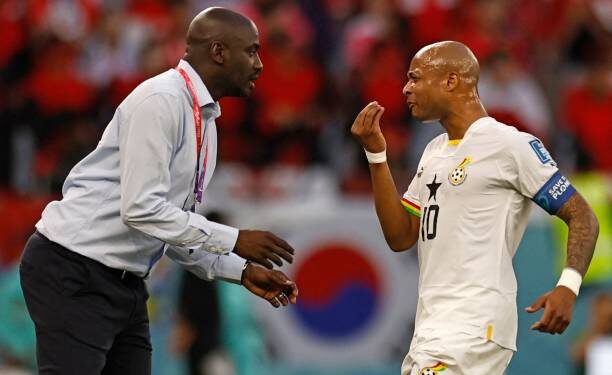 TOPSHOT - Ghana's coach Otto Addo (L) speaks with Ghana's midfielder #10 Andre Ayew during the Qatar 2022 World Cup Group H football match between South Korea and Ghana at the Education City Stadium in Al-Rayyan, west of Doha, on November 28, 2022. (Photo by Khaled DESOUKI / AFP) (Photo by KHALED DESOUKI/AFP via Getty Images)
