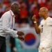 TOPSHOT - Ghana's coach Otto Addo (L) speaks with Ghana's midfielder #10 Andre Ayew during the Qatar 2022 World Cup Group H football match between South Korea and Ghana at the Education City Stadium in Al-Rayyan, west of Doha, on November 28, 2022. (Photo by Khaled DESOUKI / AFP) (Photo by KHALED DESOUKI/AFP via Getty Images)