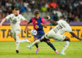 Lamine Yamal right wingerof Barcelona and Spain and Mohammed Salisu centre-back of Monaco and Ghana compete for the ball during the Joan Gmaper Trophy match between FC Barcelona and AS Monaco at Estadi Olimpic Lluis Companys on August 12, 2024 in Barcelona, Spain. (Photo by Jose Breton/Pics Action/NurPhoto via Getty Images)