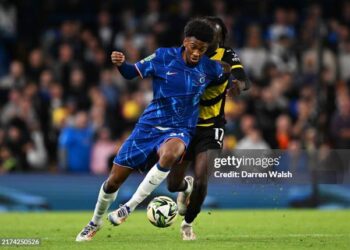 LONDON, ENGLAND - SEPTEMBER 24: Josh-Kofi Acheampong of Chelsea is challenged by Katia Kouyate of Barrow during the Carabao Cup Third Round match between Chelsea and Barrow at Stamford Bridge on September 24, 2024 in London, England. (Photo by Darren Walsh/Chelsea FC via Getty Images)