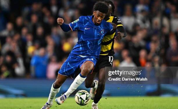 LONDON, ENGLAND - SEPTEMBER 24: Josh-Kofi Acheampong of Chelsea is challenged by Katia Kouyate of Barrow during the Carabao Cup Third Round match between Chelsea and Barrow at Stamford Bridge on September 24, 2024 in London, England. (Photo by Darren Walsh/Chelsea FC via Getty Images)
