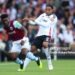 LONDON, ENGLAND - SEPTEMBER 14: Mohammed Kudus of West Ham United is challenged by Kenny Tete of Fulham during the Premier League match between Fulham FC and West Ham United FC at Craven Cottage on September 14, 2024 in London, England. (Photo by Richard Pelham/Getty Images)