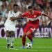 MADRID, SPAIN - SEPTEMBER 17: Jamie Leweling of VfB Stuttgart compete for the ball with Vinicius Junior of Real Madrid during the UEFA Champions League 2024/25 League Phase MD1 match between Real Madrid CF and VfB Stuttgart at Estadio Santiago Bernabeu on September 17, 2024 in Madrid, Spain. (Photo by MB Media/Getty Images)