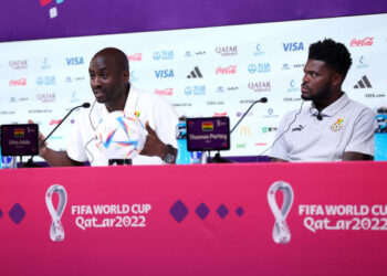 DOHA, QATAR - DECEMBER 01: Otto Addo, Head Coach of Ghana, and Thomas Partey of Ghana speak during the Ghana Press Conference at the Main Media Center on December 01, 2022 in Doha, Qatar. (Photo by Christopher Lee/Getty Images)