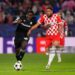 GIRONA, SPAIN - OCTOBER 02: Ibrahim Osman of Feyenoord controls the ball whilst under pressure from Arnaut Danjuma of Girona FC during the UEFA Champions League 2024/25 League Phase MD2 match between Girona FC and Feyenoord at Montilivi Stadium on October 02, 2024 in Girona, Spain. (Photo by Pedro Salado/Getty Images)
