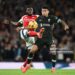 LONDON, ENGLAND - OCTOBER 27: Luis Diaz of Liverpool is challenged by Thomas Partey of Arsenal during the Premier League match between Arsenal FC and Liverpool FC at Emirates Stadium on October 27, 2024 in London, England. (Photo by Stuart MacFarlane/Arsenal FC via Getty Images)