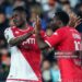 Monaco's French midfielder #19 Youssouf Fofana (R) celebrates with teammate Monaco's Ghanaian defender #22 Mohammed Salisu (L) after scoring his team's second goal during the French L1 football match between Montpellier Herault SC and AS Monaco at Stade de la Mosson in Montpellier, southern France, on May 12, 2024. (Photo by Pascal GUYOT / AFP) (Photo by PASCAL GUYOT/AFP via Getty Images)