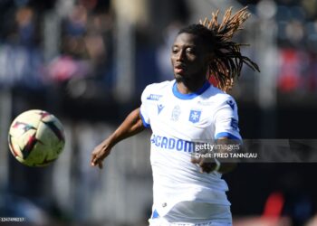 Auxerre's Ghanaian defender Gideon Mensah runs with the ball during the French L1 football match between FC Lorient and AJ Auxerre at Stade du Moustoir in Lorient, western France on February 26, 2023. (Photo by FRED TANNEAU / AFP) (Photo by FRED TANNEAU/AFP via Getty Images)