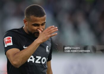 Freiburg's Ghanaian midfielder Daniel-Kofi Kyereh clears his nose during the German first division Bundesliga football match VfL Wolfsburg v SC Freiburg in Wolfsburg, northern Germany, on January 21, 2023. - - DFL REGULATIONS PROHIBIT ANY USE OF PHOTOGRAPHS AS IMAGE SEQUENCES AND/OR QUASI-VIDEO (Photo by Ronny HARTMANN / AFP) / DFL REGULATIONS PROHIBIT ANY USE OF PHOTOGRAPHS AS IMAGE SEQUENCES AND/OR QUASI-VIDEO (Photo by RONNY HARTMANN/AFP via Getty Images)